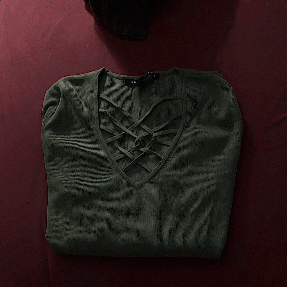 This is a green long sleeve shirt